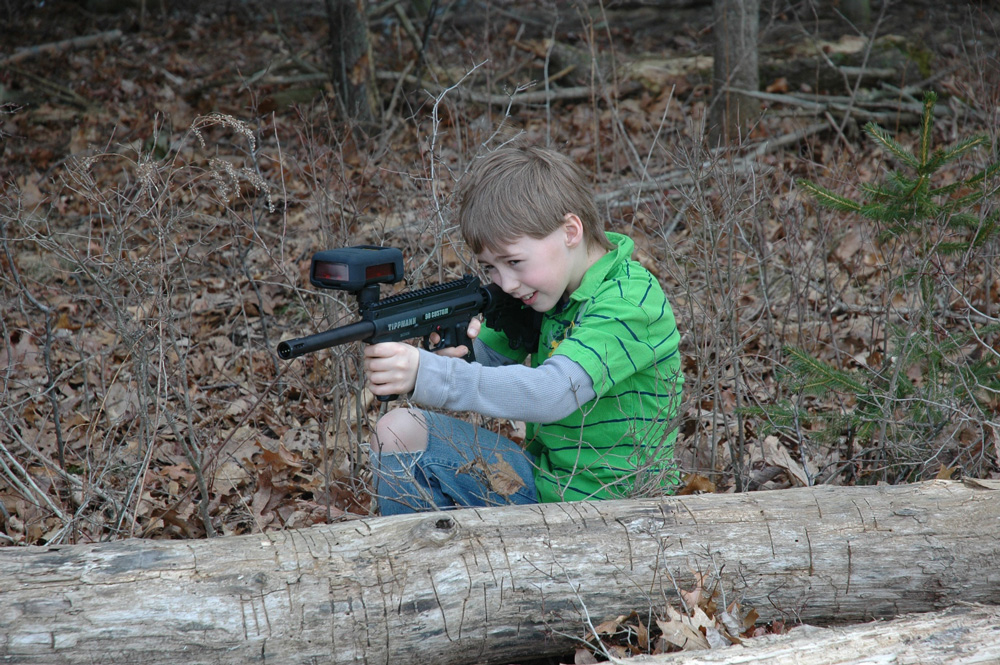 Young Boy Playing Laser Tag